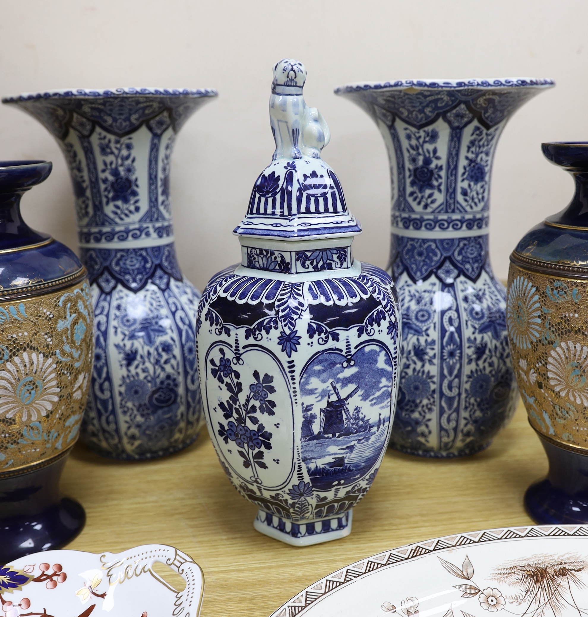 Seven ceramic pieces including a pair of Royal Doulton vases, Coalport dish and Delft jar and cover, 34cm high